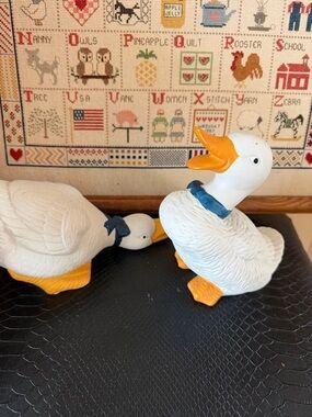 Pair of White Ceramic Duck Figurines with Blue Bows